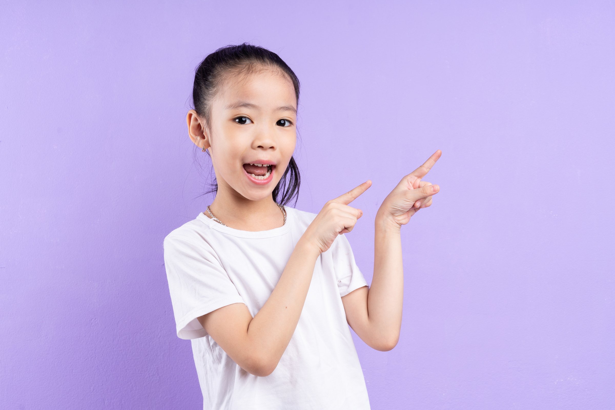 Portrait of Asian Child on Purple Background